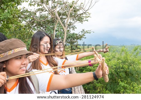 Nakornratchasima Thailand,23 May : Volunteers join together use catapult shoot rubber seeds to soil in reforestation project on May 23, 2015 in Nakornratchasima Thailand.