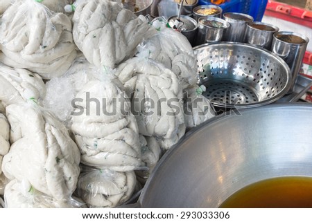 Thailand street food raw fish ball prepare for deep fried in the pan.