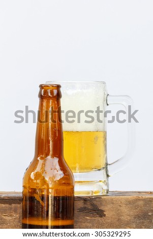 International beer day with beer glass and top beer bottle on white background.