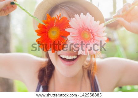Young Woman Covering Her Eyes With Fresh Colorful Flowers. Enjoying Spring Time