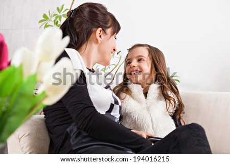 Cute little girl and her mother for Mother\'s day. Focus is on mother and daughter.