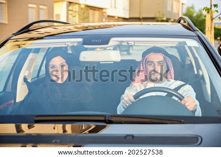 Young Arabic Couple Traveling By Car