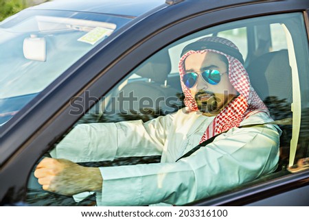 Young Arabian Businessman Driving The Car