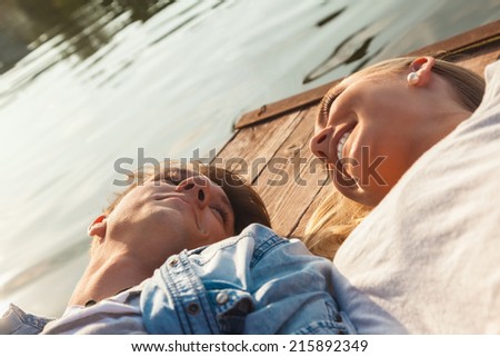Group Of Young Friends Relaxing On A Boat Enjoying Sunny Day