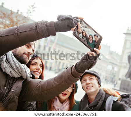 Group Of Cheerful Tourists Taking Selfie Using Digital Tablet
