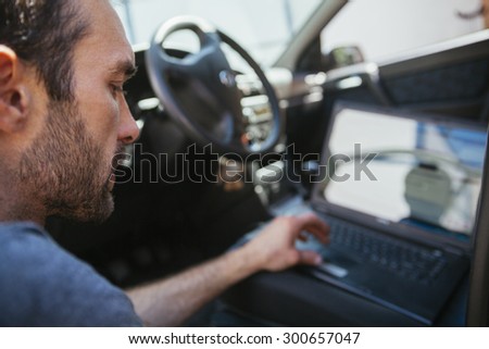 Auto Mechanic Doing Diagnostic Test