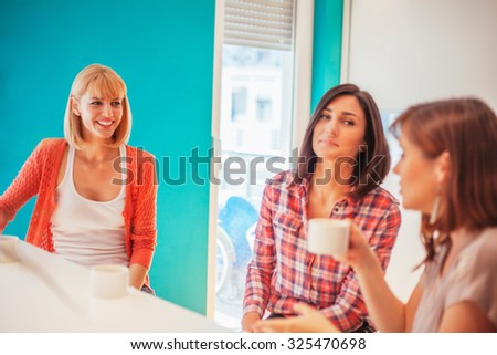 Female Friends Socializing At Home