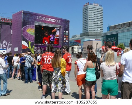 WARSAW, POLAND - JUNE 16: Polish football fans queuing for the entry to the Fan zone tribunes hours before UEFA EURO 2012 football match vs. Czech national team, June 16, 2012 in Warsaw, Poland