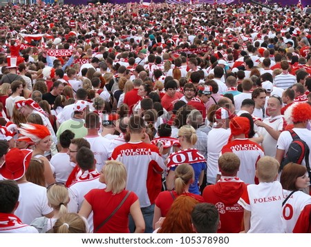 WARSAW, POLAND - JUNE 16: Thousands of Polish fans gathered in Fanzone, to support national team minutes before UEFA EURO 2012 football match vs. Czech team, June 16, 2012 in Warsaw, Poland