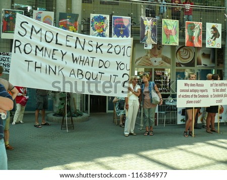 WARSAW - JULY 31: crowd challenges Mitt Romney to take stand on Russian investigation of Smolensk 2010 presidential plane crash, during his Warsaw visit on July 31, 2012 in Warsaw, Poland