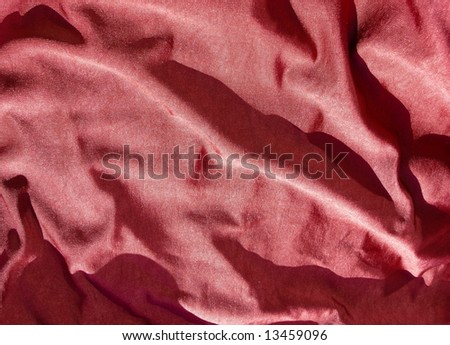 Creased red satin cotton fabric. Ideal for Christmas, bedroom, bed sheet, bed linens, bed cover, fashion, abstract, valentines, sexy textile background design. More textiles and background in my port.