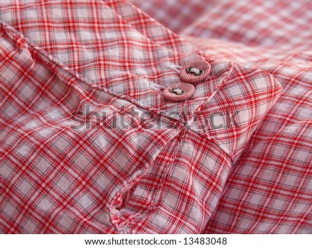 Close up of a checkered shirt cuff. Series - red. More fabrics in my port.