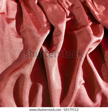 Creased red satin fabric. For Christmas, bedroom, bed sheet, bed linens, bed cover, fashion, abstract, valentines, drapery, sexy textile background design. More textiles and background in my port.