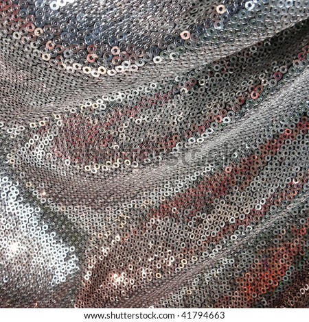 silver shiny metallic 80s style fabric closeup. More of this motif & more textiles in my port.