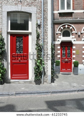 entrance entry wooden door colorful white red brick  building residential. More of this motif & more doors in my port.