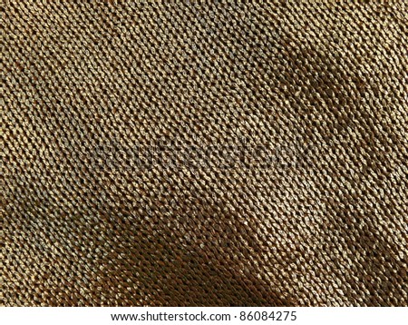 Metallic elegant crochet fabric close up.
