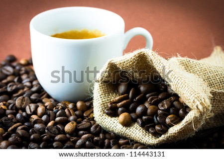 Coffee beans in a jute bag and cup