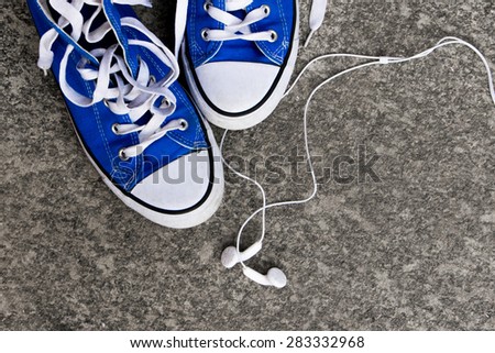 Sneakers and earphones - Adolescence concept