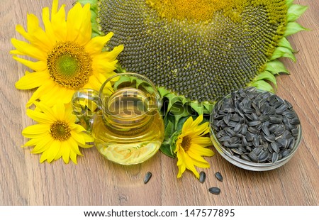 mature seeds and sunflower oil, sunflower flowers close-up. top view - horizontal photo.
