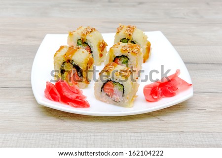 Salmon Fried Maki Sushi - Hot Roll with Cream Cheese and Cucumber inside. Horizontal photo.
