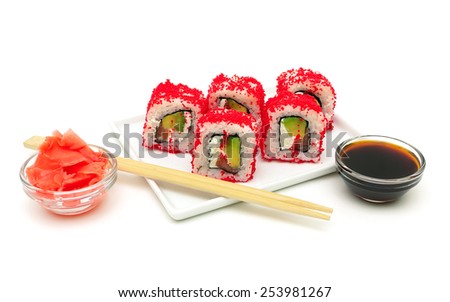 rolls with avocado, salmon and fish roe on a plate on a white background. horizontal photo.