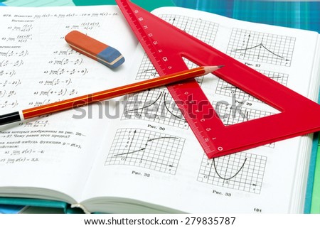 school supplies and textbooks on mathematics close up. Horizontal photo.
