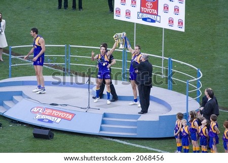 The west coast eagles holding the winning cup aloft at the 2006 AFL grand final