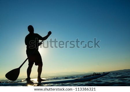 Man on Stand Up Paddle Board