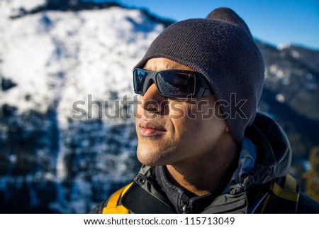 Young black man on snowshoe hike.