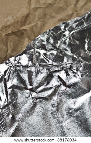 crumpled foil and crumpled brown package paper
