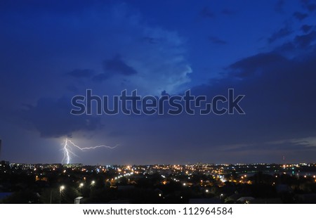 Lightning strike over night city