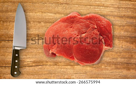 knife on cutting board and fresh meat isolated on white background