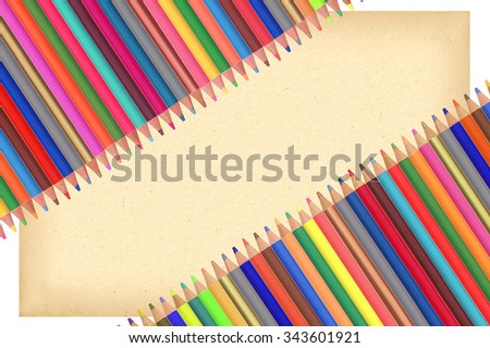 Colour pencils and paper isolated on white background