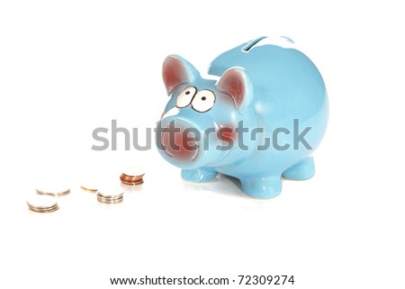 A front portrait studio isolation view on a white background of blue ceramic piggy bank with some coins in front.
