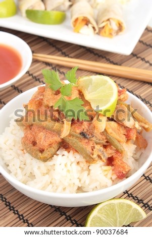 Thai chicken curry with coconut milk and lime. Served with crispy spring rolls and sweet and sour sauce.