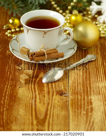 Cup of tea on the Christmas table. Christmas background. Christmas card family comfort. Homeliness.