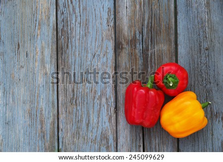 Food background. Fresh pepper on old wooden table. Cover for the book.