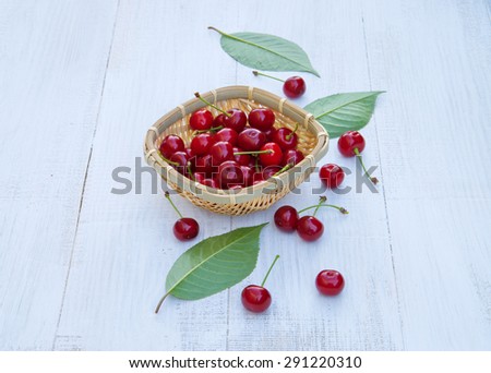 Ripe cherries on an old wooden table. Harvest berries. space for text. white wooden table
