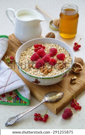 Healthy breakfast - Oatmeal, yogurt, fresh fruit, honey. health and diet concept. rural motif.