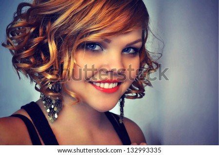 Portrait of a young ginger haired woman smiling
