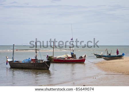 The Group of fishing boats parking on the sea of Thailand.