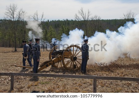 AIKEN, SOUTH CAROLINA - FEBRUARY 25: Cadets fire a cannon at an American Civil War (1861-1865) reenactment by dedicated civil war history enthusiasts on February 25, 2012 in Aiken, South Carolina.