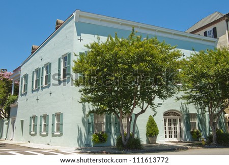 A green town house from the early 1800's in  Old Town Charleston, South Carolina.
