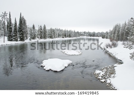 A snow packed winter on the Buffalo River which is a tributary of the upper Henry\'s Fork of the Snake River in Southeast Idaho.