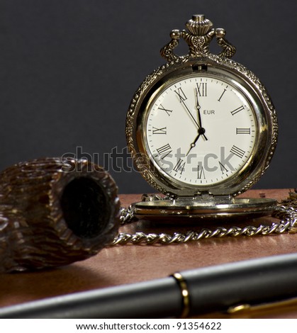 The pipe, the pen and the old watch