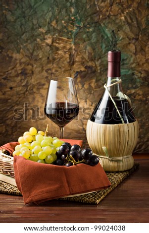 Grape, bottle and glass of wine.