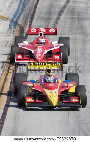 LONG BEACH, CA. - APR 17: Sebastian Saavedra in the #34 car leads Scott Dixon in the #9 car during the Toyota Grand Prix of Long Beach on April 17, 2011 in Long Beach, CA.