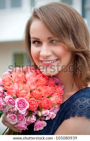 Closeup portrait of pretty young lady with flowers
