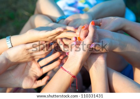 Many hands rising the sky together