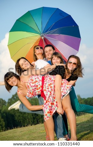 Big group of young girls  with umbrella